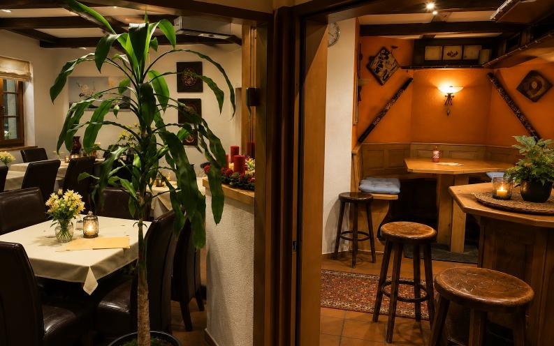 Cozy boutique hotel restaurant corner at Verdo Hotel with warm wooden interiors, bar seating, soft ambient lighting, and elegant European atmosphere.