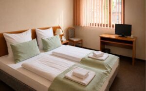 Bright Verdo Hotel double room with comfortable double bed, soft natural light, workspace desk, and cozy boutique hotel atmosphere.