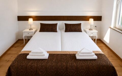 Verdo Hotel double room with large double bed, warm bedside lighting, and clean modern boutique hotel interior.