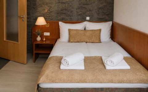 Verdo Hotel double room with comfortable double bed, warm bedside lamp, and clean modern boutique hotel interior.