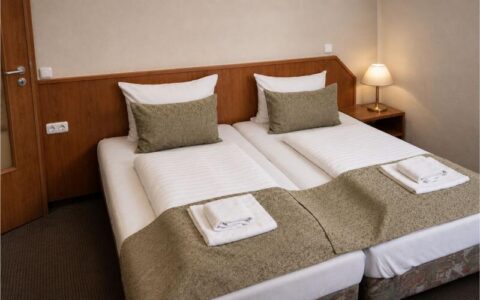 Verdo Hotel double room with comfortable double bed, warm bedside lighting, and clean boutique-style accommodation interior.